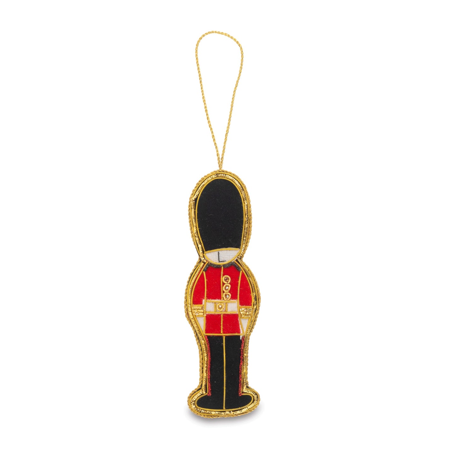A small hanging ornament shaped like a toy soldier in a red uniform with a black hat and gold trim, suspended by a thin gold string on a white background.