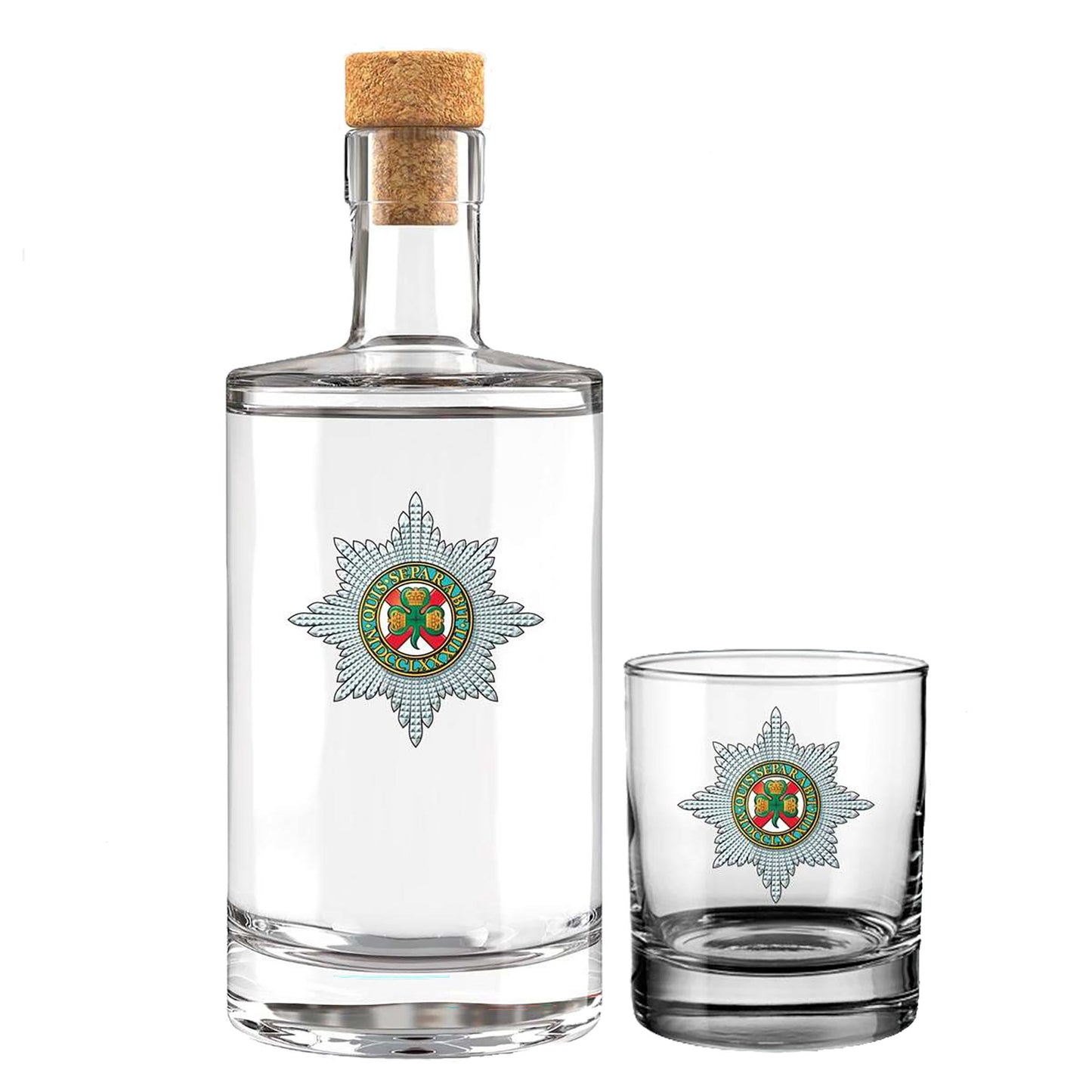 A clear glass decanter with a cork stopper and a matching small clear glass tumbler, both printed with a, shown on a white background the insignia of the Irish Guards.