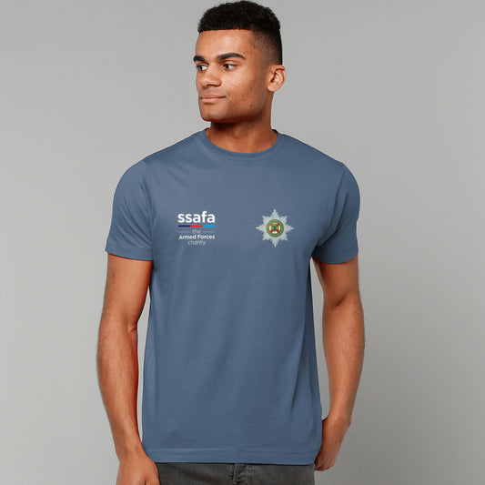 A man wearing a indigo  blue short-sleeve t-shirt with 'ssafa' and Irish Guards insignia printed on the chest, photographed against a solid grey studio background.