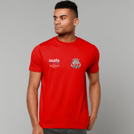 A man wearing a red short-sleeve t-shirt with 'ssafa' and Merchant Navy insignia printed on the chest, photographed against a solid grey studio background.