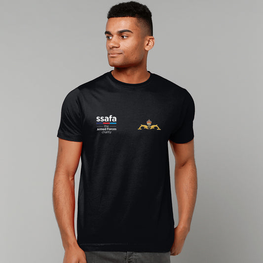 A man wearing black short-sleeve t-shirt with 'ssafa' and Submarine Service (King's Crown) insignia printed on the chest, photographed against a solid grey studio background.