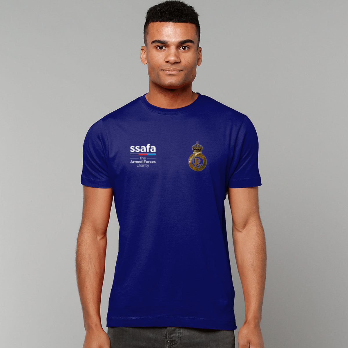 A man wearing a navy t-shirt showing an MOD licensed Blues and Royals (King's Crown) insignia to left chest and SSAFA logo to right chest.