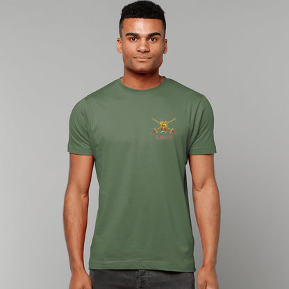 A man wearing a military green t-shirt showing an MOD licensed British Army (Queen's Crown) insignia to left chest.
