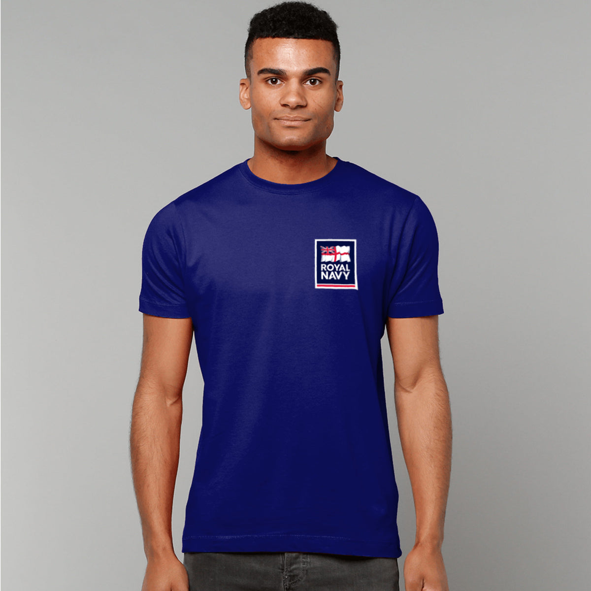 A man wearing a navy t-shirt showing an MOD licensed Royal Navy 'logo' to left chest.