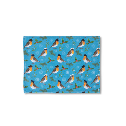 Patterned placemat with Robins wearing Military hats of Army, Royal Navy and RAF, with holly and mistletoe and holly on a blue background.