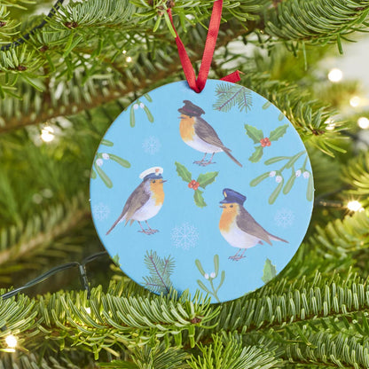 Christmas Robins pop-out hanging card featuring festive robins and holly, transforms into a hanging ornament. Shown close up hanging on a Christmas Tree.