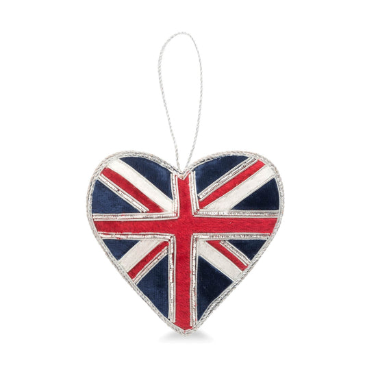 A heart-shaped hanging ornament featuring a distressed Union Jack flag design with red, white, and navy blue colors and a silver hanging loop.