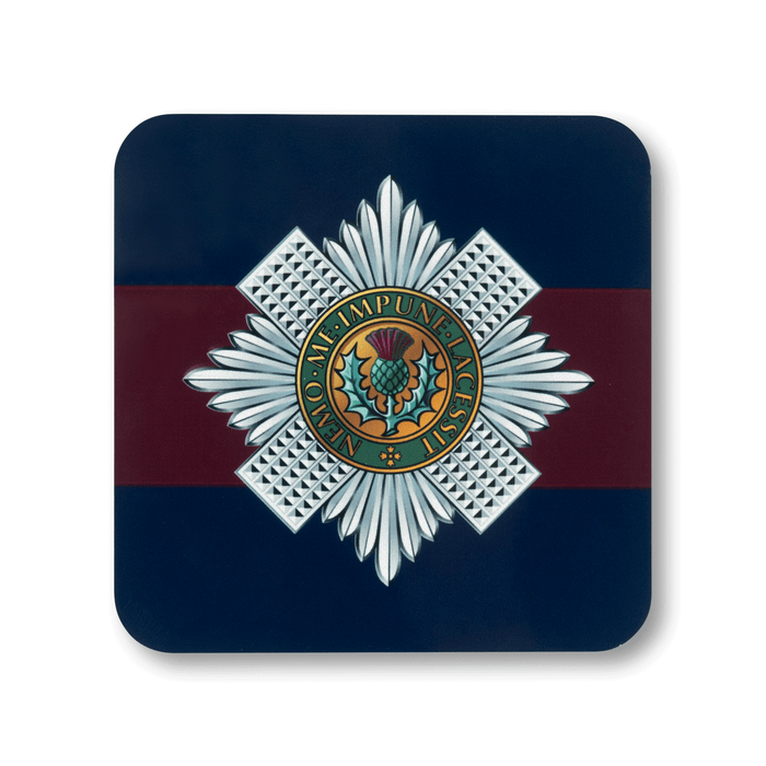 A square coaster with rounded corners featuring the Scots Guards insignia, on a striped navy and maroon background.