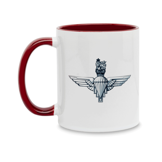 A white ceramic mug with a maroon handle and interior, featuring a printed insignia of the Parachute Regiment on the front. Set against a plain white background.