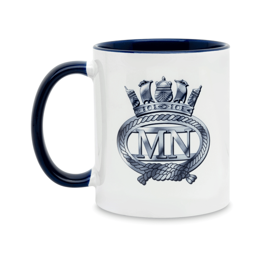 A white ceramic mug with a navy handle and interior, featuring a printed insignia of the Merchant Navy on the front. Set against a plain white background.