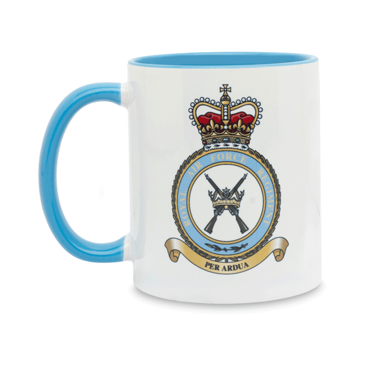 A white ceramic mug with a blue handle and interior, featuring a printed insignia of the RAF Regiment (Queen’s Crown) on the front. Set against a plain white background.