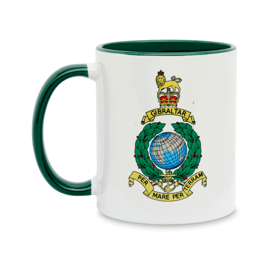 A white ceramic mug with a dark green handle and interior, featuring the insignia of the Royal Marines featuring the Queen's Crown printed on the front.