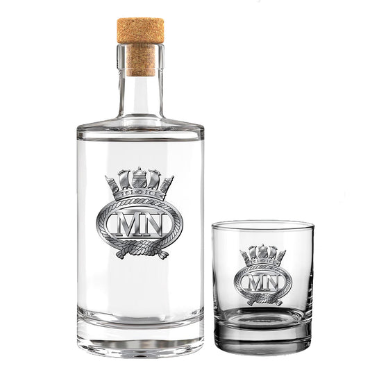 A clear glass bottle with a cork stopper and a matching clear glass tumbler, both displaying the insignia of the Merchant Navy featuring the letters 'MN' inside a crown motif, shown on a white background.