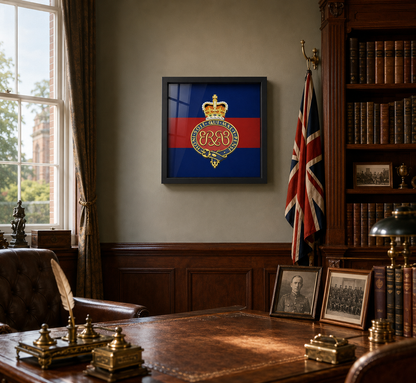 A framed Grenadier Guards (Queen's Crown) insignia displayed on a beige wall in a vintage, book-filled study with a wooden desk, leather chair, and union flag.