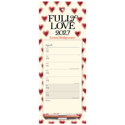 A vertical desk calendar pad titled 'FULL OF LOVE 2027' with the name Emma Bridgewater printed below. The pad has a cream background with a border of red hearts, a printed April weekly schedule, and a pencil resting at the bottom.