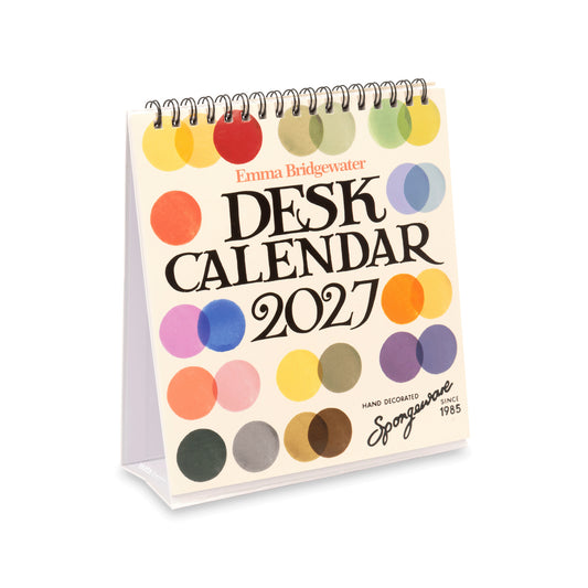 Emma Bridgewater 2027 Spiral Desk Calendar on a clean white background. The cream-colored cover features colorful overlapping circles in orange, yellow, green, blue, pink, purple, and brown, with black text reading 'DESK CALENDAR 2027'.