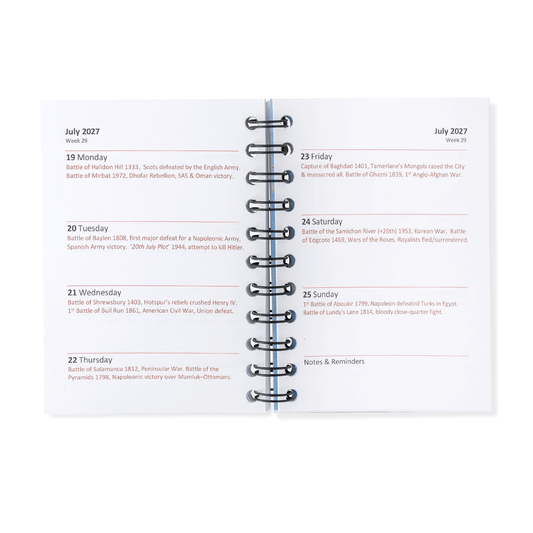 A spiral-bound planner page spread showing a monthly calendar layout with dates from July 2027, including event listings and a notes and reminders section, photographed on a clean white background.