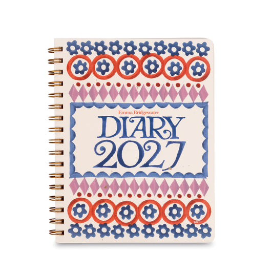 A square-format diary cover design with the title 'Emma Bridgewater DIARY 2027' in large blue lettering, surrounded by decorative border patterns in blue, red-orange, and pink on a cream background. The author name 'Emma Bridgwater' appears above the title.