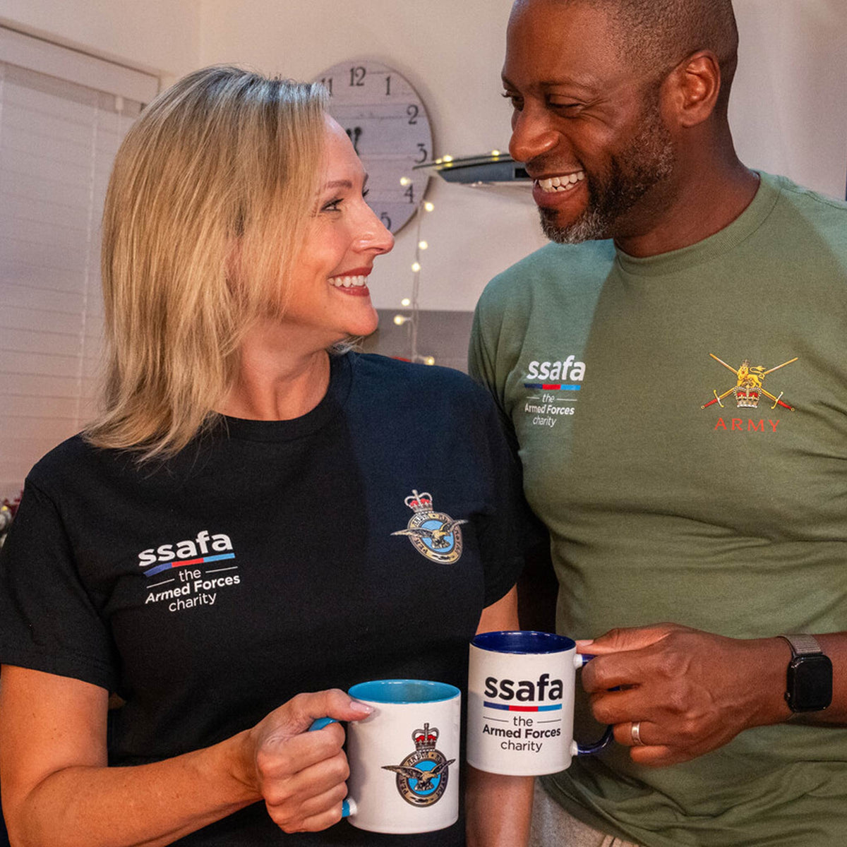 A woman and man wearing MOD Licenced military T-shirts, Army and RAF.